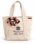 Prudence Signature Flower Tote — natural canvas tote with handmade satin flower and Prudence New York emblem