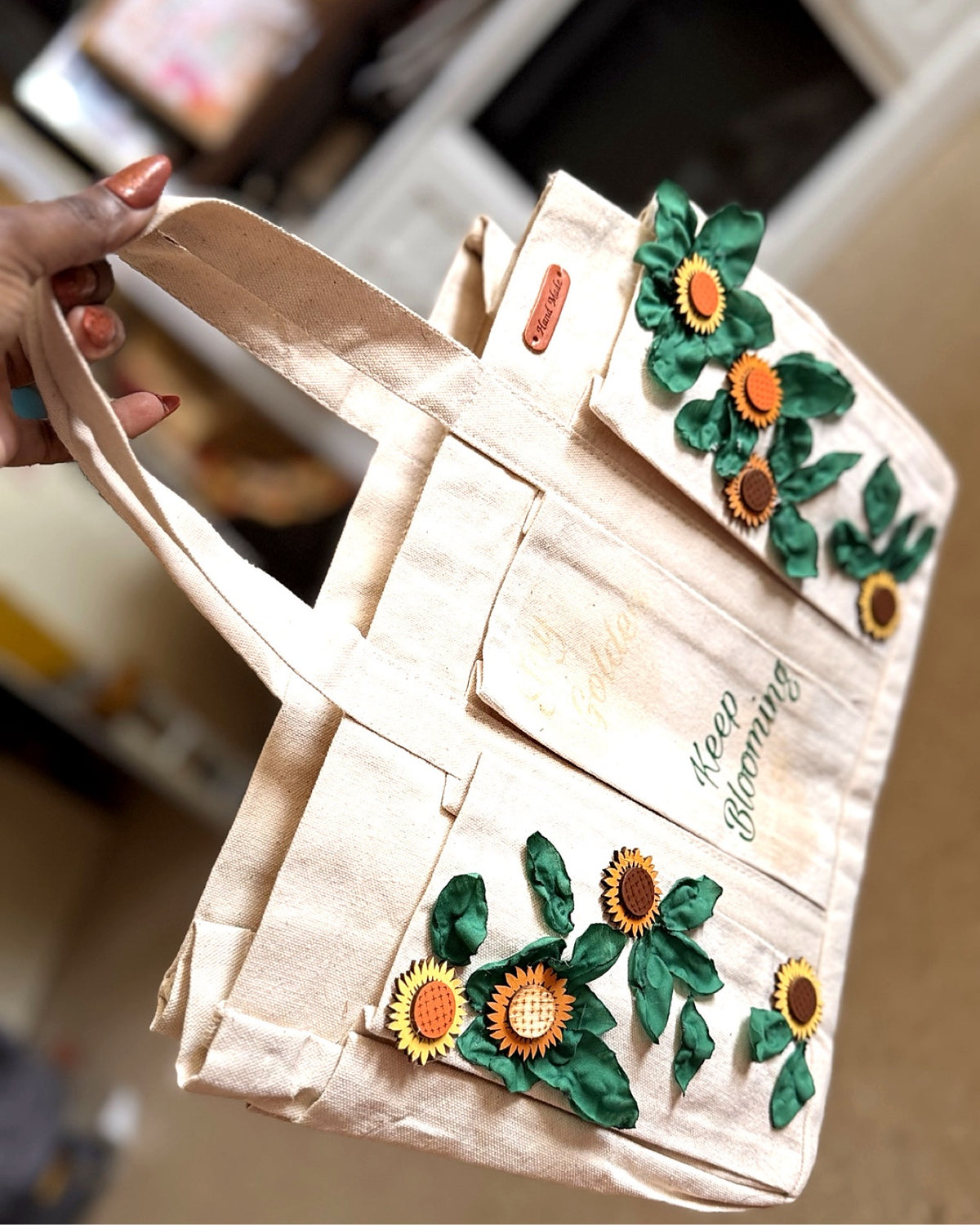 Keep Blooming Sunflower Tote — held in hand